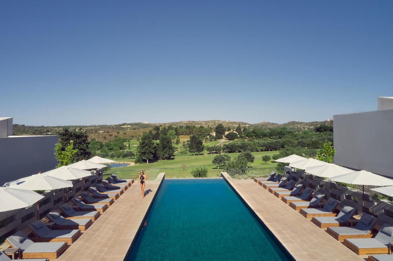Minthis Resort Tsadha Exterior photo The pool at the hotel
