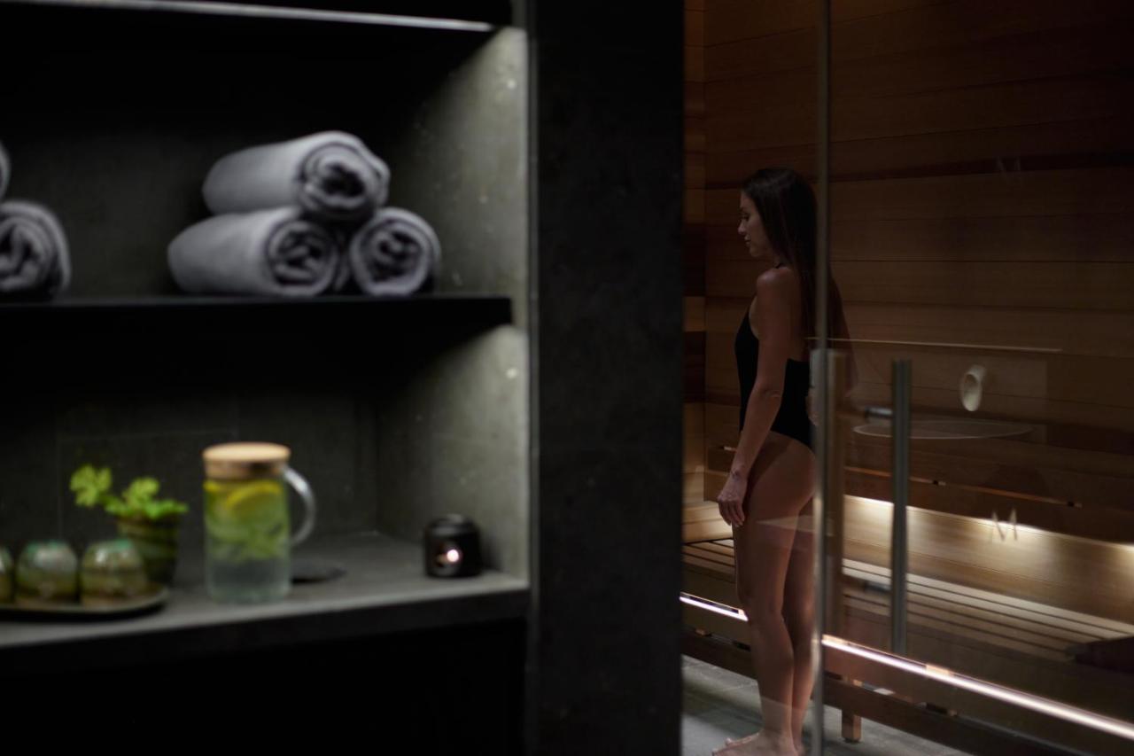 Minthis Resort Tsadha Exterior photo A woman in a sauna